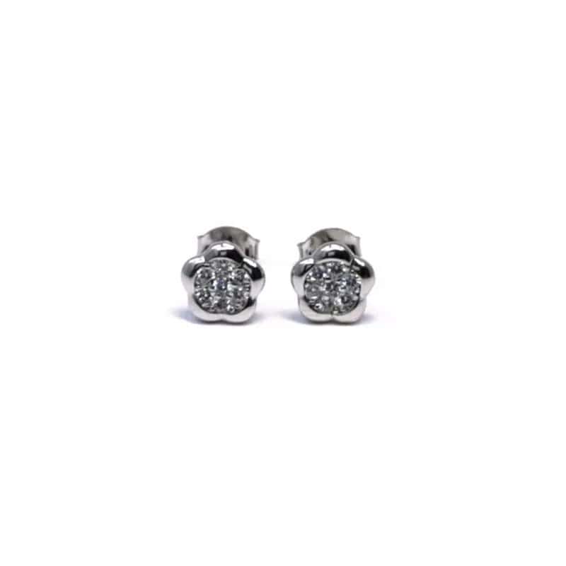 Pendientes de flor de plata con piedras blancas